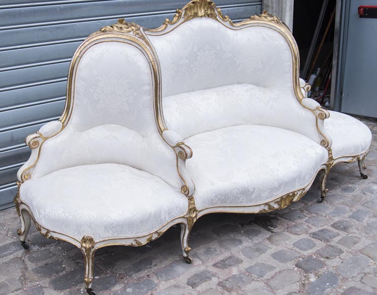A large Louis XV style bench made out of gilded wood - Seating