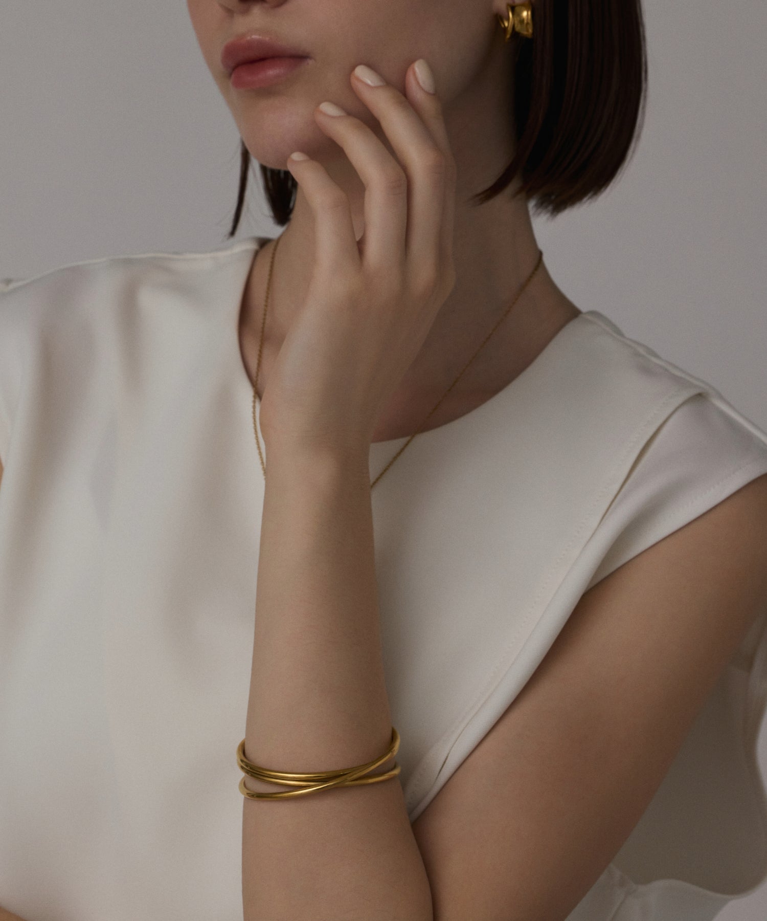 ゴールド]ツイストアーチバングル